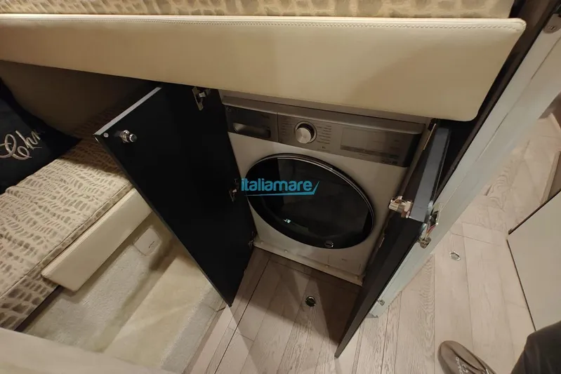  Yacht Photos Pics Laundry area inside 2018 Cranchi 60 ST yacht with built-in washing machine.