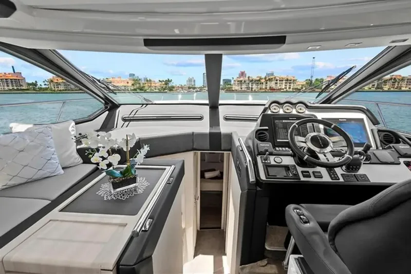 Lithium Yacht Photos Pics Luxurious 2015 Azimut 55S yacht interior with modern helm and scenic waterfront view.