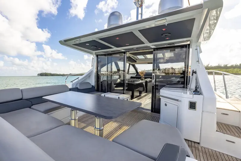 Lithium Yacht Photos Pics Luxury 2015 Azimut 55S yacht with spacious outdoor seating and modern interior design.