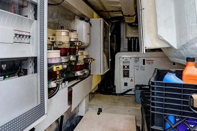 Lithium Yacht Photos Pics Engine room of a 2015 Azimut 55S yacht, featuring technical equipment and storage.