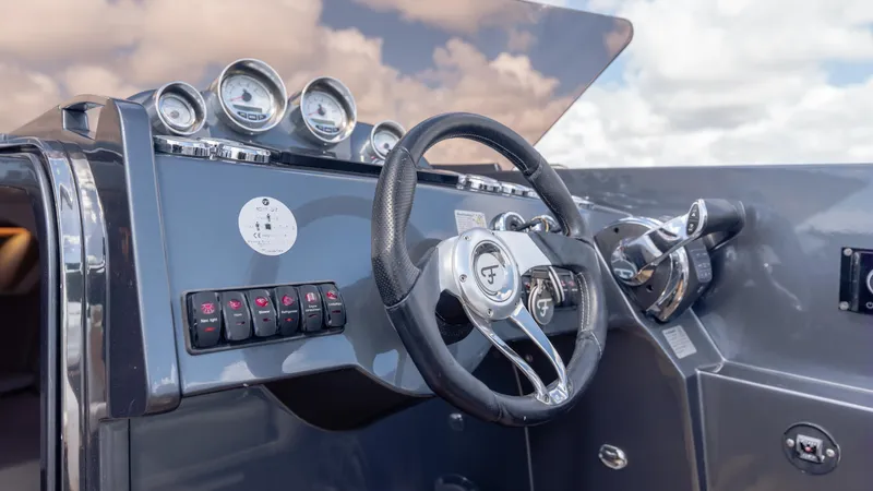 1017gt2017 Yacht Photos Pics Steering console of 2017 Frauscher 1017 GT boat with gauges and controls.