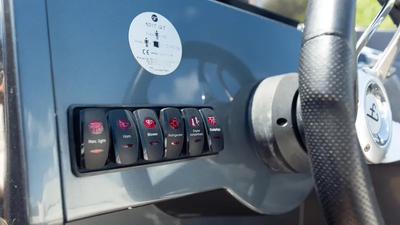 1017gt2017 Yacht Photos Pics Control panel of a 2017 Frauscher 1017 GT boat with labeled switches.