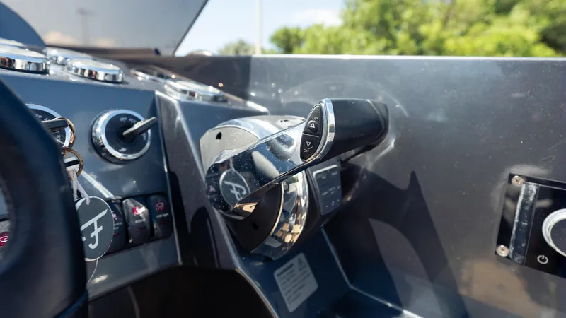 1017gt2017 Yacht Photos Pics Control panel of a 2017 Frauscher 1017 GT boat with steering and throttle.