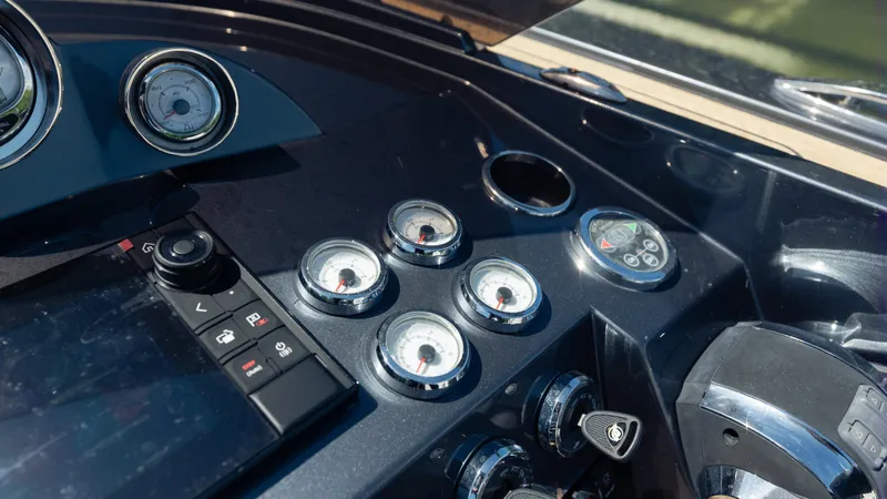 1017gt2017 Yacht Photos Pics Dashboard of a 2017 Frauscher 1017 GT boat with gauges and controls.