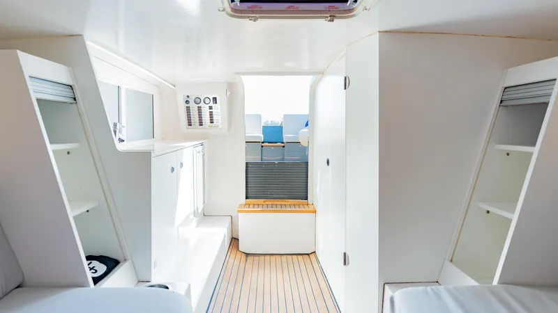 1017gt2017 Yacht Photos Pics Interior of 2017 Frauscher 1017 GT boat, featuring sleek white cabinetry and modern design.