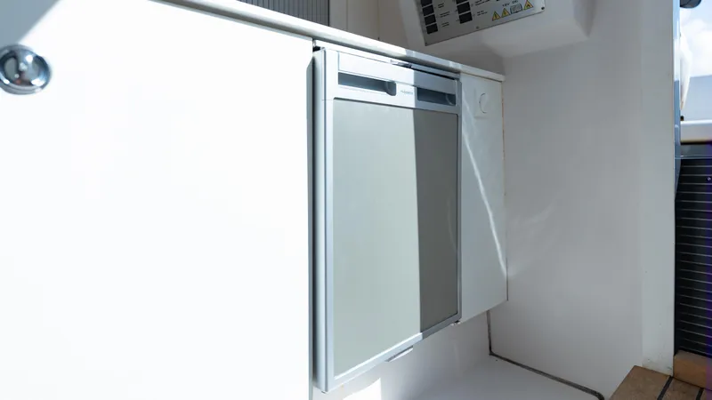 1017gt2017 Yacht Photos Pics Compact refrigerator in 2017 Frauscher 1017 GT boat interior.