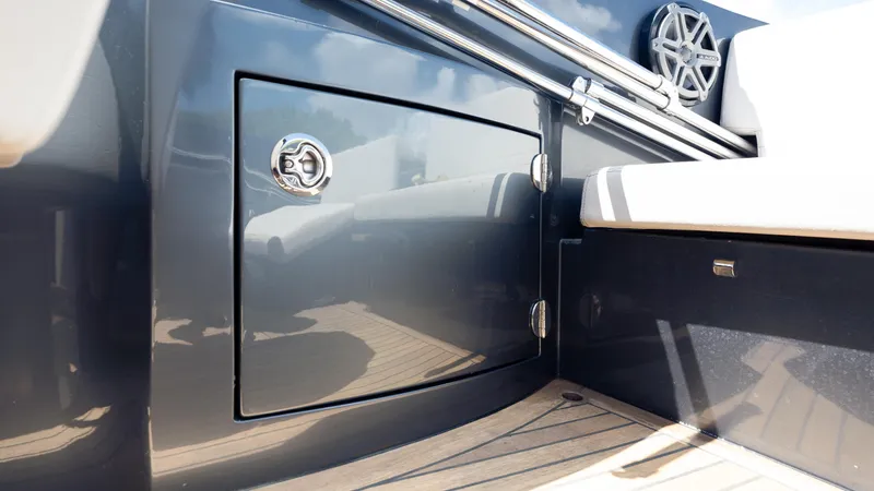 1017gt2017 Yacht Photos Pics 2017 Frauscher 1017 GT boat interior detail with storage compartment and speaker.