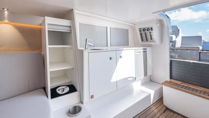 1017gt2017 Yacht Photos Pics Interior of 2017 Frauscher 1017 GT yacht with modern cabinetry and seating.