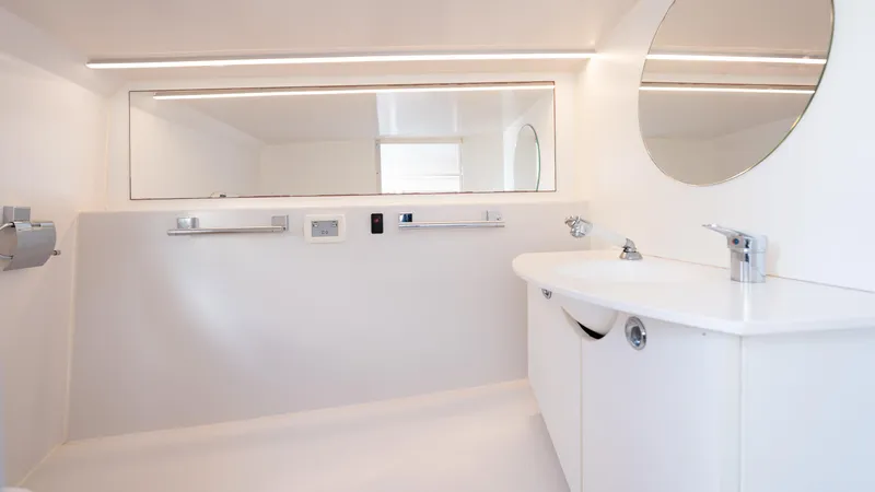 1017gt2017 Yacht Photos Pics Luxurious bathroom interior of 2017 Frauscher 1017 GT yacht, featuring modern fixtures and mirrors.