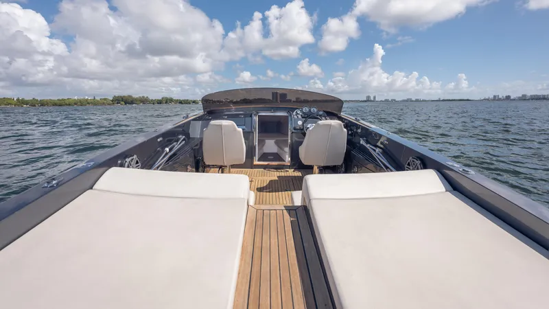 1017gt2017 Yacht Photos Pics 2017 Frauscher 1017 GT luxury boat interior with sun loungers on open water.