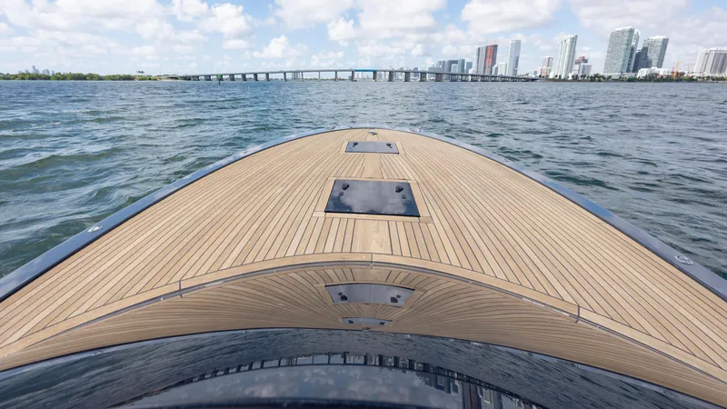 1017gt2017 Yacht Photos Pics Frauscher 1017 GT 2017 yacht deck with city skyline and bridge in background.