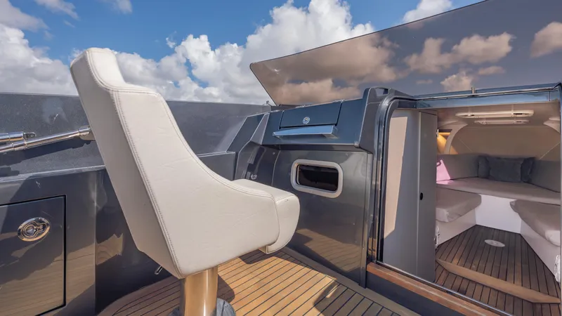 1017gt2017 Yacht Photos Pics 2017 Frauscher 1017 GT yacht interior with helm seat and cabin view.