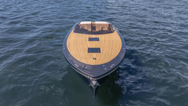 1017gt2017 Yacht Photos Pics 2017 Frauscher 1017 GT luxury boat on open water, featuring sleek wooden deck design.