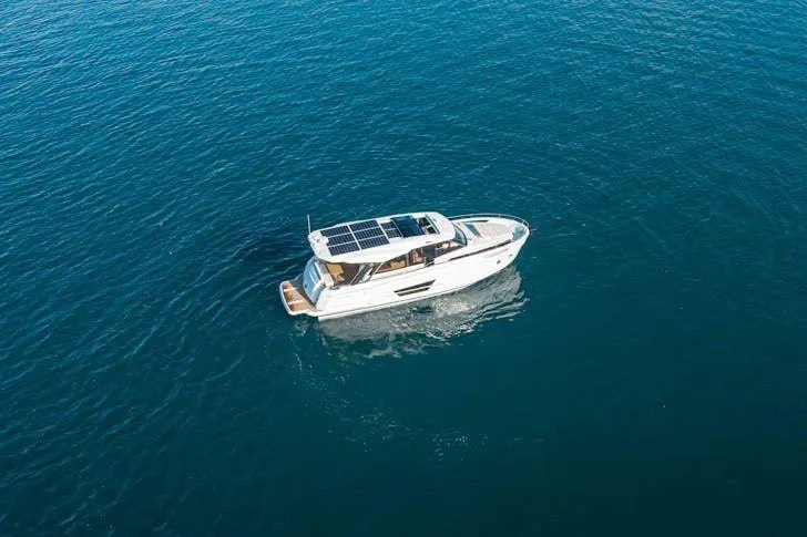  Yacht Photos Pics 2022 Greenline 45 Coupe yacht with solar panels cruising on open water.