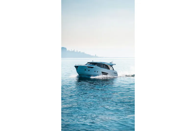  Yacht Photos Pics 2022 Greenline 45 Coupe yacht cruising on serene blue waters.