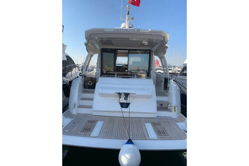  Yacht Photos Pics 2022 Greenline 45 Coupe yacht docked at marina, rear view.