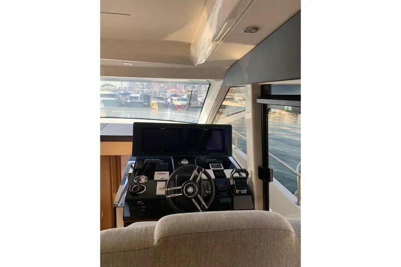  Yacht Photos Pics Interior helm of 2022 Greenline 45 Coupe yacht with modern navigation equipment.