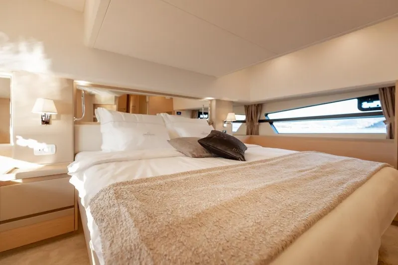  Yacht Photos Pics Luxurious bedroom interior of 2022 Greenline 45 Coupe yacht with elegant bedding.