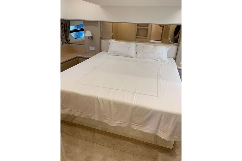  Yacht Photos Pics Luxurious bedroom interior of 2022 Greenline 45 Coupe yacht with elegant bedding.
