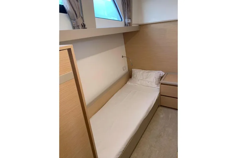  Yacht Photos Pics Modern cabin interior of 2022 Greenline 45 Coupe with single bed and window.