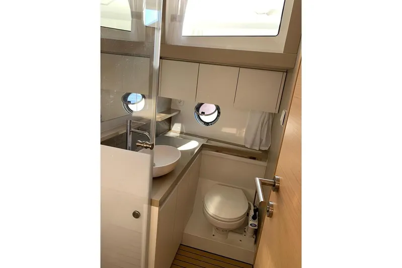  Yacht Photos Pics Modern bathroom in 2022 Greenline 45 Coupe yacht, featuring sleek design and compact amenities.