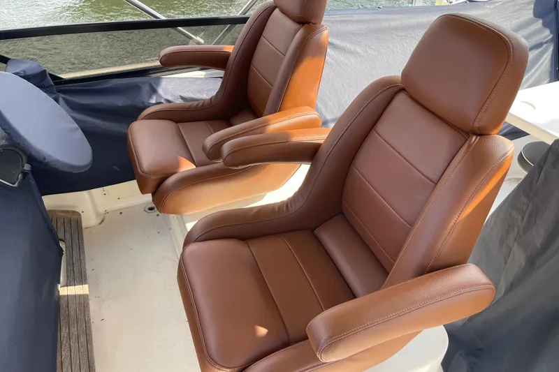 Passe Ports V Yacht Photos Pics Luxurious brown leather seats on 2004 Neptunus 56 Flybridge yacht.