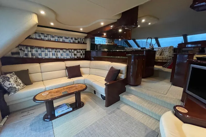 Passe Ports V Yacht Photos Pics Luxurious 2004 Neptunus 56 Flybridge yacht interior with elegant seating and modern design.