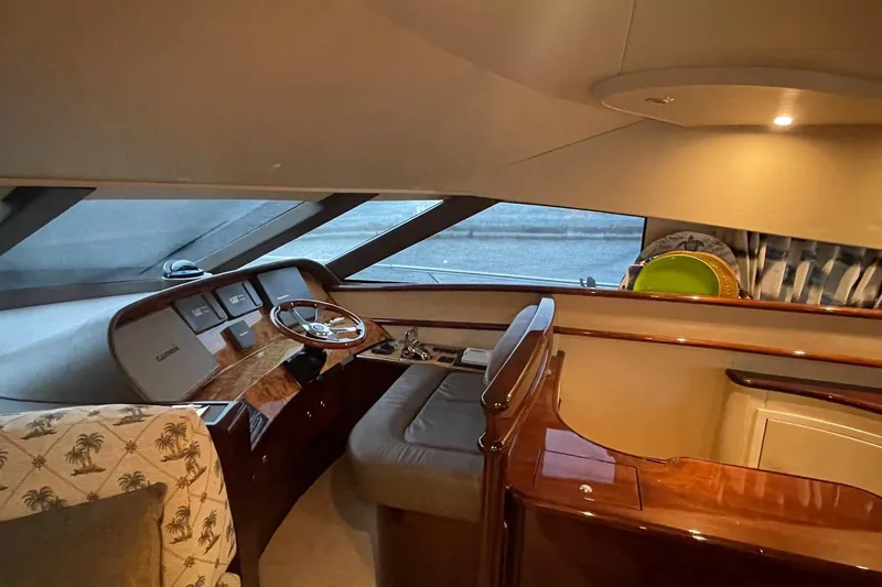 Passe Ports V Yacht Photos Pics Luxurious interior of a 2004 Neptunus 56 Flybridge yacht with elegant wood finishes.