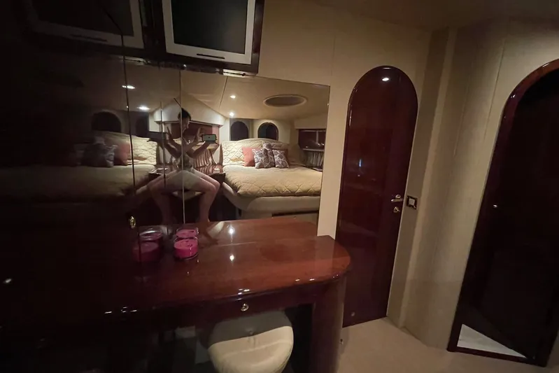 Passe Ports V Yacht Photos Pics Luxurious interior of 2004 Neptunus 56 Flybridge yacht with elegant wood finishes.