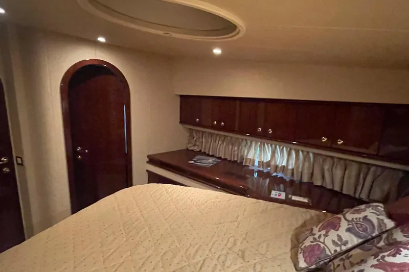 Passe Ports V Yacht Photos Pics Luxurious cabin interior of 2004 Neptunus 56 Flybridge yacht with elegant wood finish.