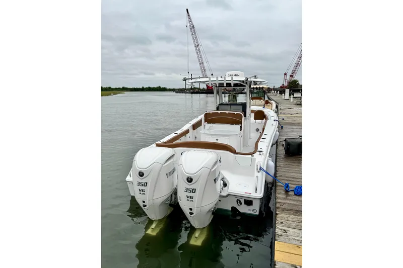  Yacht Photos Pics 2025 Sea Hunt Ultra 305 SE boat docked with twin Yamaha 350 engines.