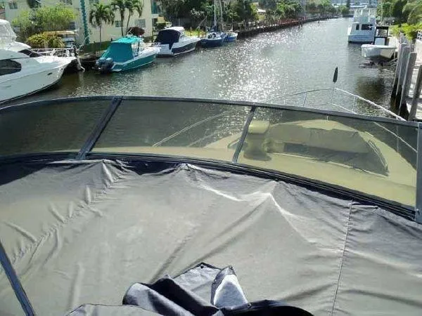 Passe Ports V Yacht Photos Pics 2004 Neptunus 56 Flybridge yacht docked in a sunny marina.