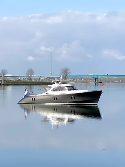  Yacht Photos Pics 2012 Zeelander Z44 yacht on calm water, reflecting a serene sky.