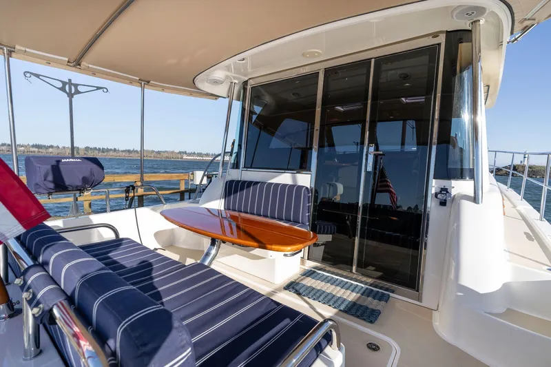 Jackson Yacht Photos Pics 2013 Sabre 38 Salon Express yacht with outdoor seating and ocean view.