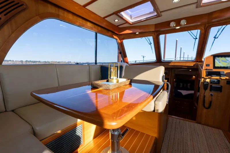 Jackson Yacht Photos Pics Luxurious interior of 2013 Sabre 38 Salon Express yacht with elegant wood finishes.