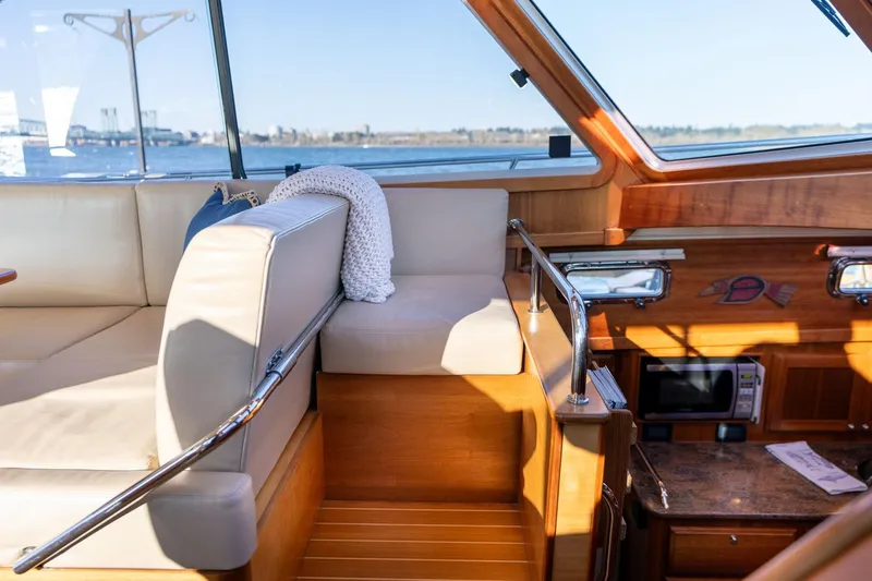 Jackson Yacht Photos Pics Interior of 2013 Sabre 38 Salon Express with beige seating and wooden accents.