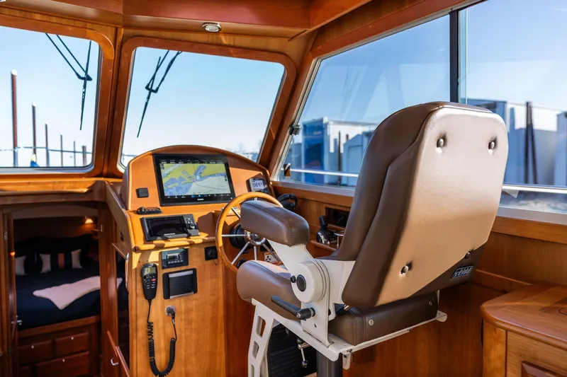 Jackson Yacht Photos Pics Interior of 2013 Sabre 38 Salon Express yacht with helm, navigation equipment, and captain's chair.