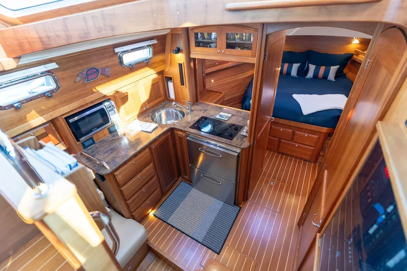 Jackson Yacht Photos Pics Luxurious interior of 2013 Sabre 38 Salon Express yacht with kitchen and bedroom.