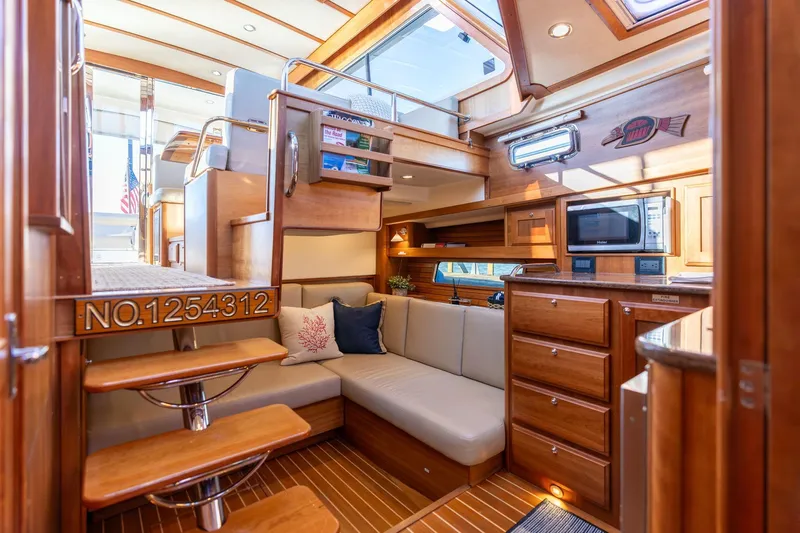 Jackson Yacht Photos Pics Luxurious interior of 2013 Sabre 38 Salon Express yacht with elegant wood finish.