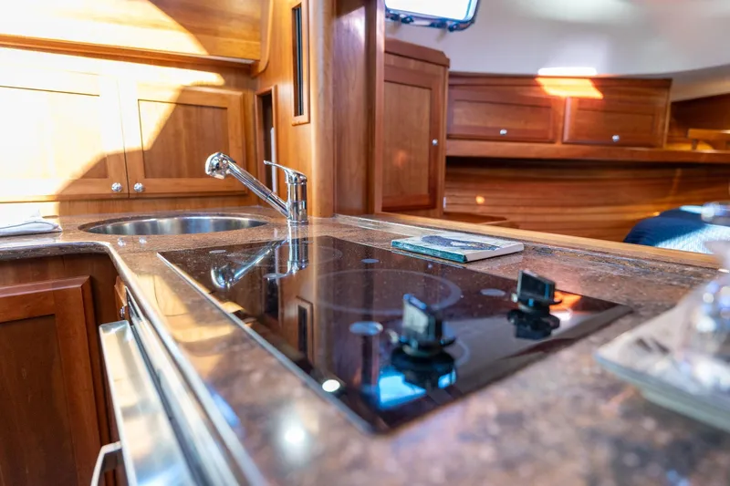 Jackson Yacht Photos Pics Interior of 2013 Sabre 38 Salon Express yacht kitchen with stove and sink.