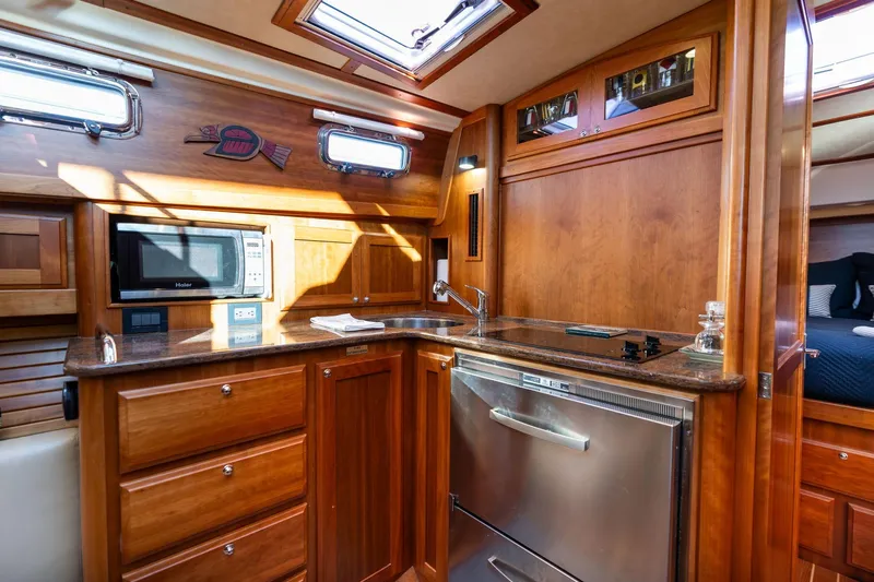 Jackson Yacht Photos Pics Luxurious 2013 Sabre 38 Salon Express yacht interior with modern kitchen amenities.
