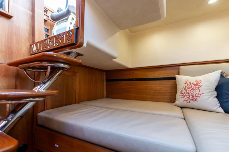 Jackson Yacht Photos Pics 2013 Sabre 38 Salon Express interior with cozy seating and decorative pillow.