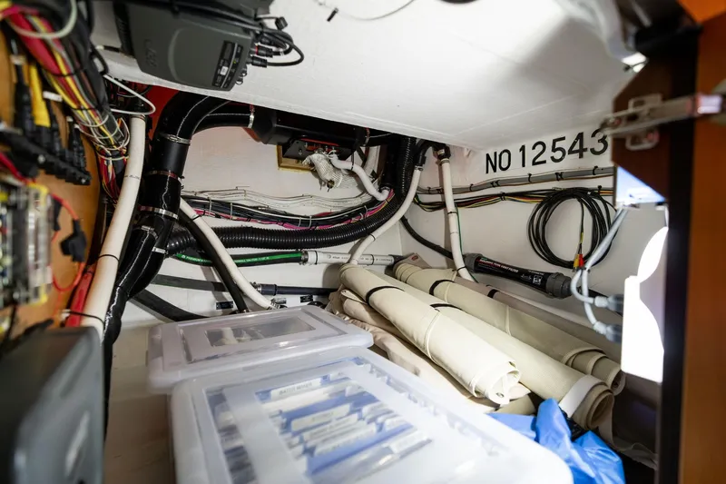 Jackson Yacht Photos Pics 2013 Sabre 38 Salon Express interior wiring and storage area with organized cables and equipment.