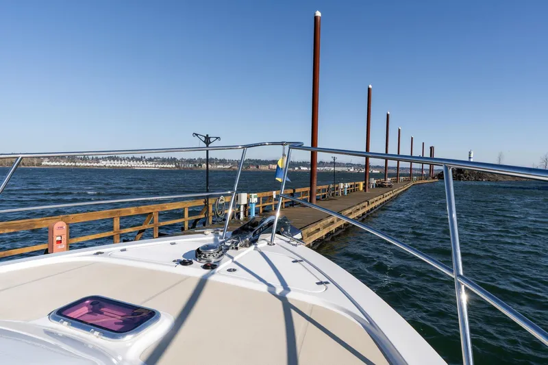 Jackson Yacht Photos Pics 2013 Sabre 38 Salon Express at dock, calm waters, clear sky, scenic view.