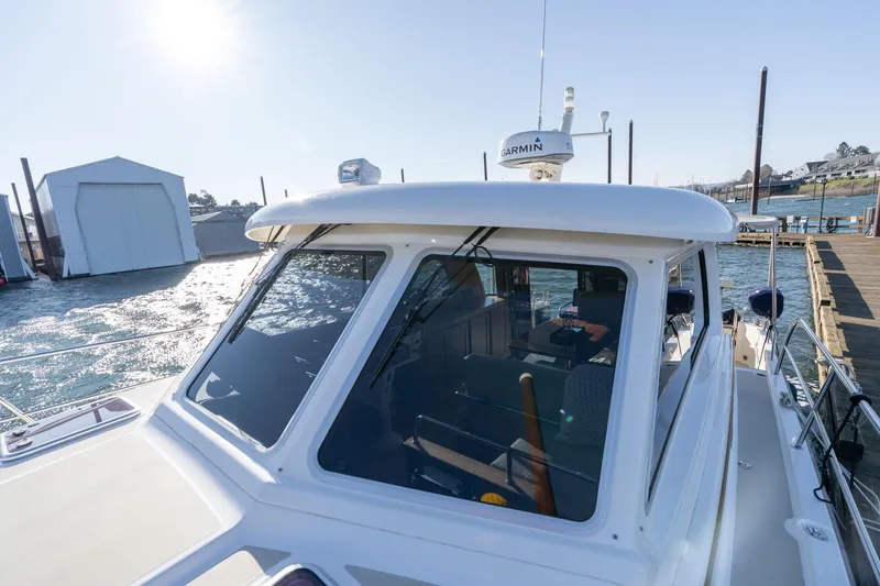 Jackson Yacht Photos Pics 2013 Sabre 38 Salon Express yacht docked, featuring Garmin equipment and sleek design.