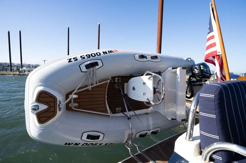 Jackson Yacht Photos Pics 2013 Sabre 38 Salon Express with dinghy and American flag on deck.