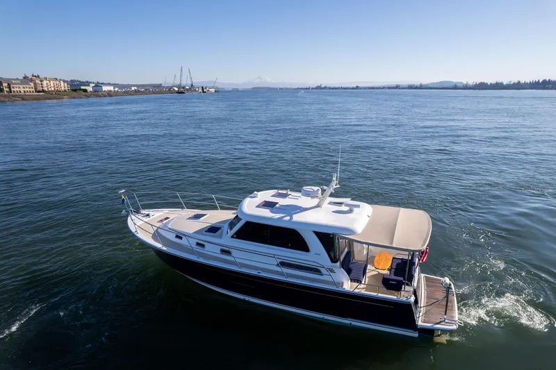 Jackson Yacht Photos Pics 2013 Sabre 38 Salon Express yacht cruising on a sunny day in open waters.