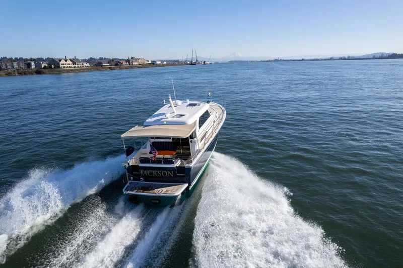 Jackson Yacht Photos Pics 2013 Sabre 38 Salon Express cruising on open water, creating a wake.