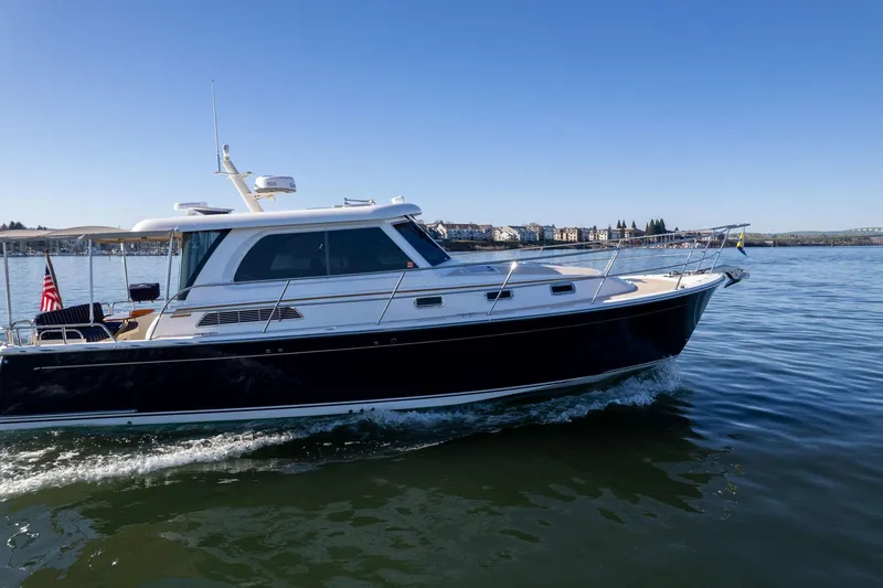 Jackson Yacht Photos Pics 2013 Sabre 38 Salon Express cruising on calm waters under clear blue skies.