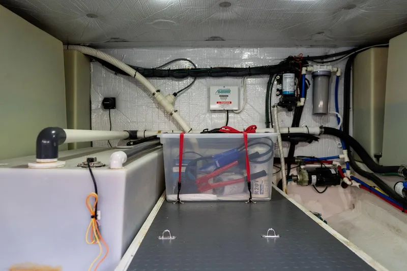 Jackson Yacht Photos Pics Engine room of 2013 Sabre 38 Salon Express with organized equipment and storage.